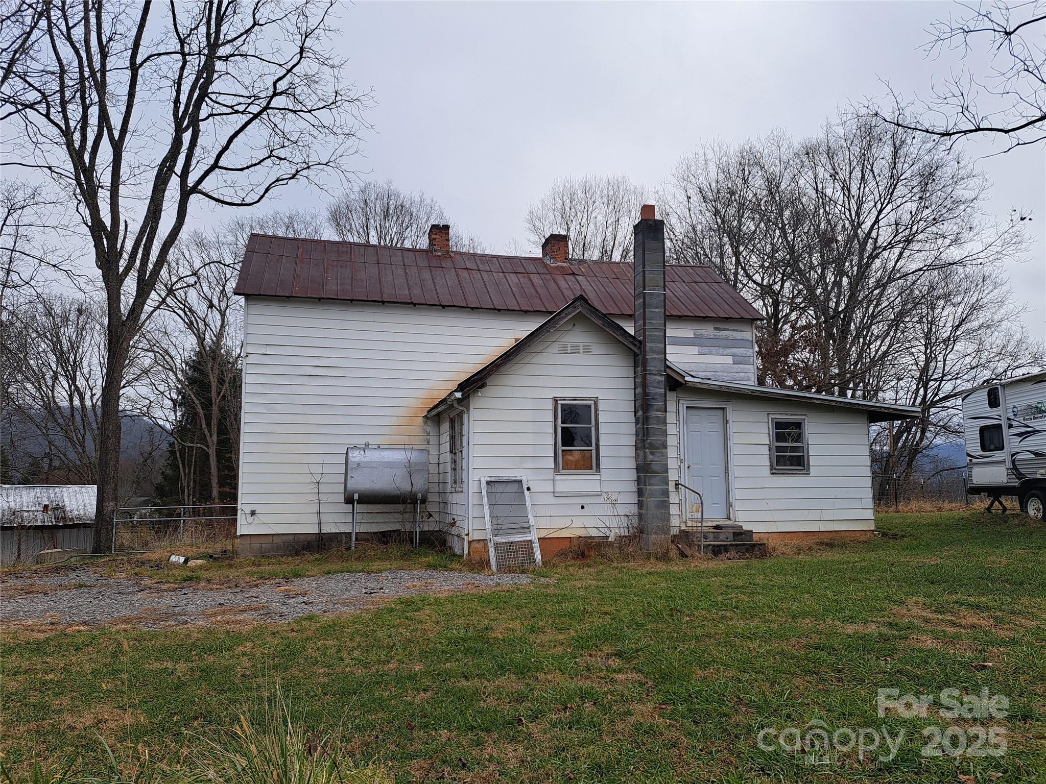 101 Knight Drive Clyde, NC 28721 - Photo 4 of 26 a view of a house with a yard