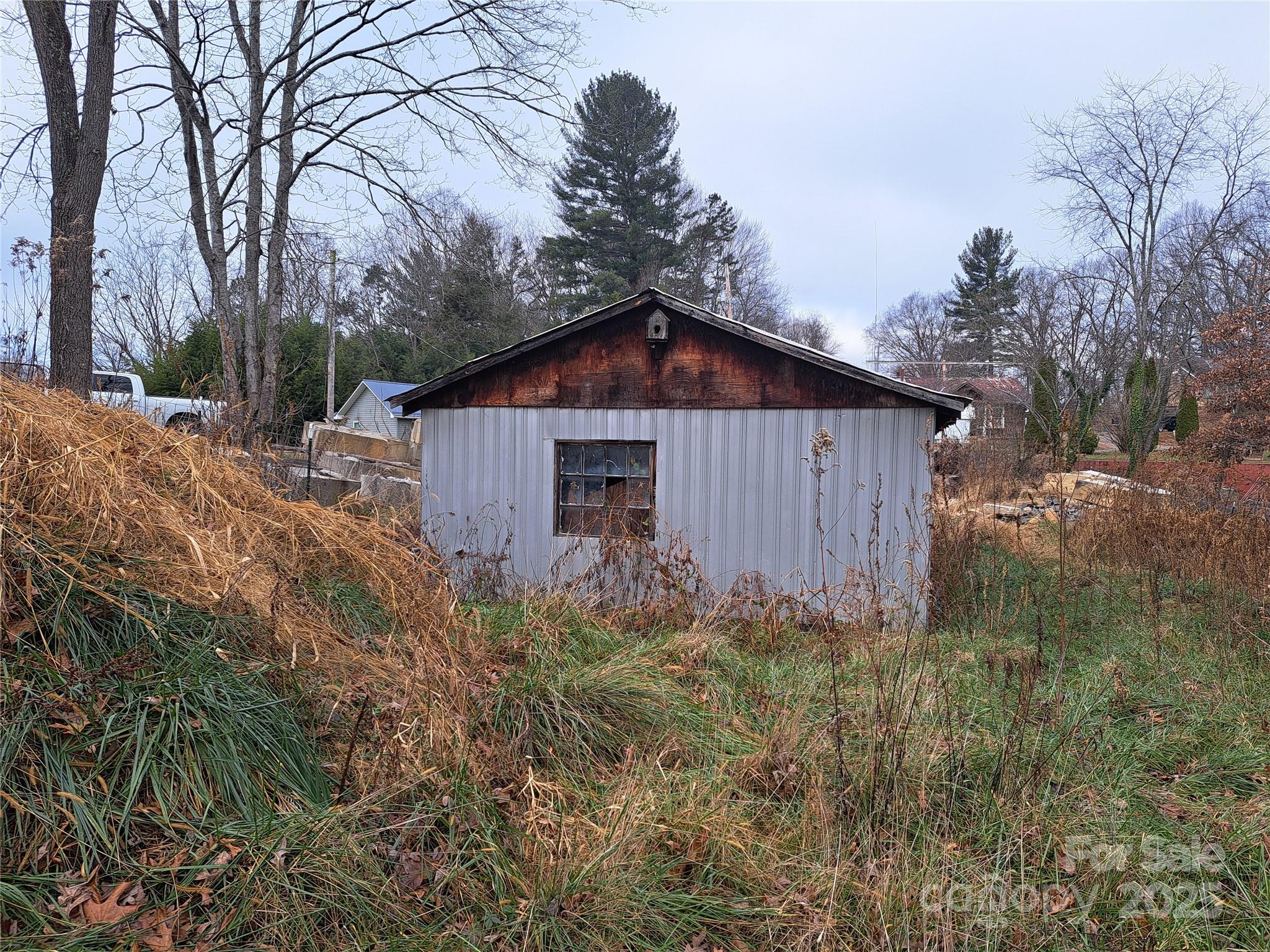 101 Knight Drive Clyde, NC 28721 - Photo 7 of 26 a backyard of a house with lots of green space