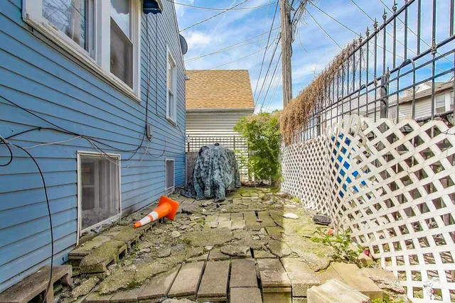 a living room with furniture a rug and a chandelier