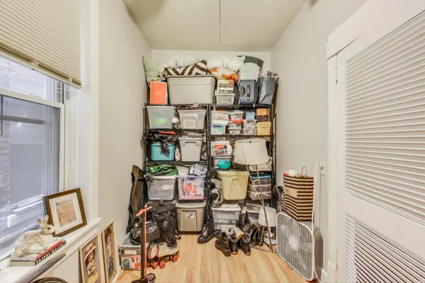 a utility room with dryer washer and a view of living room