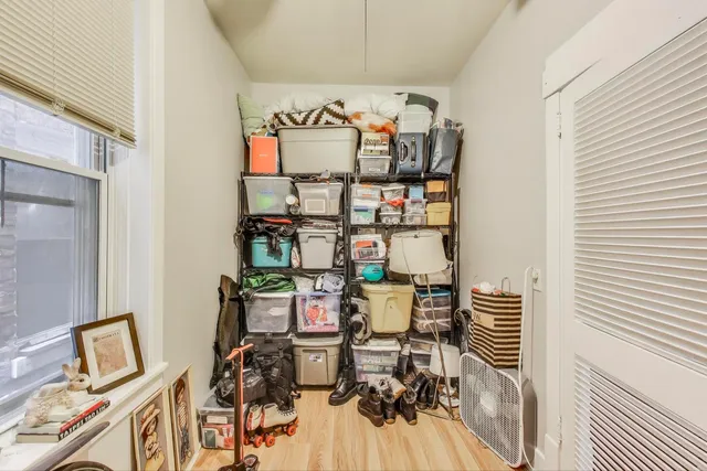 a utility room with dryer washer and a view of living room