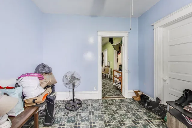 a view of a workspace with furniture and closet