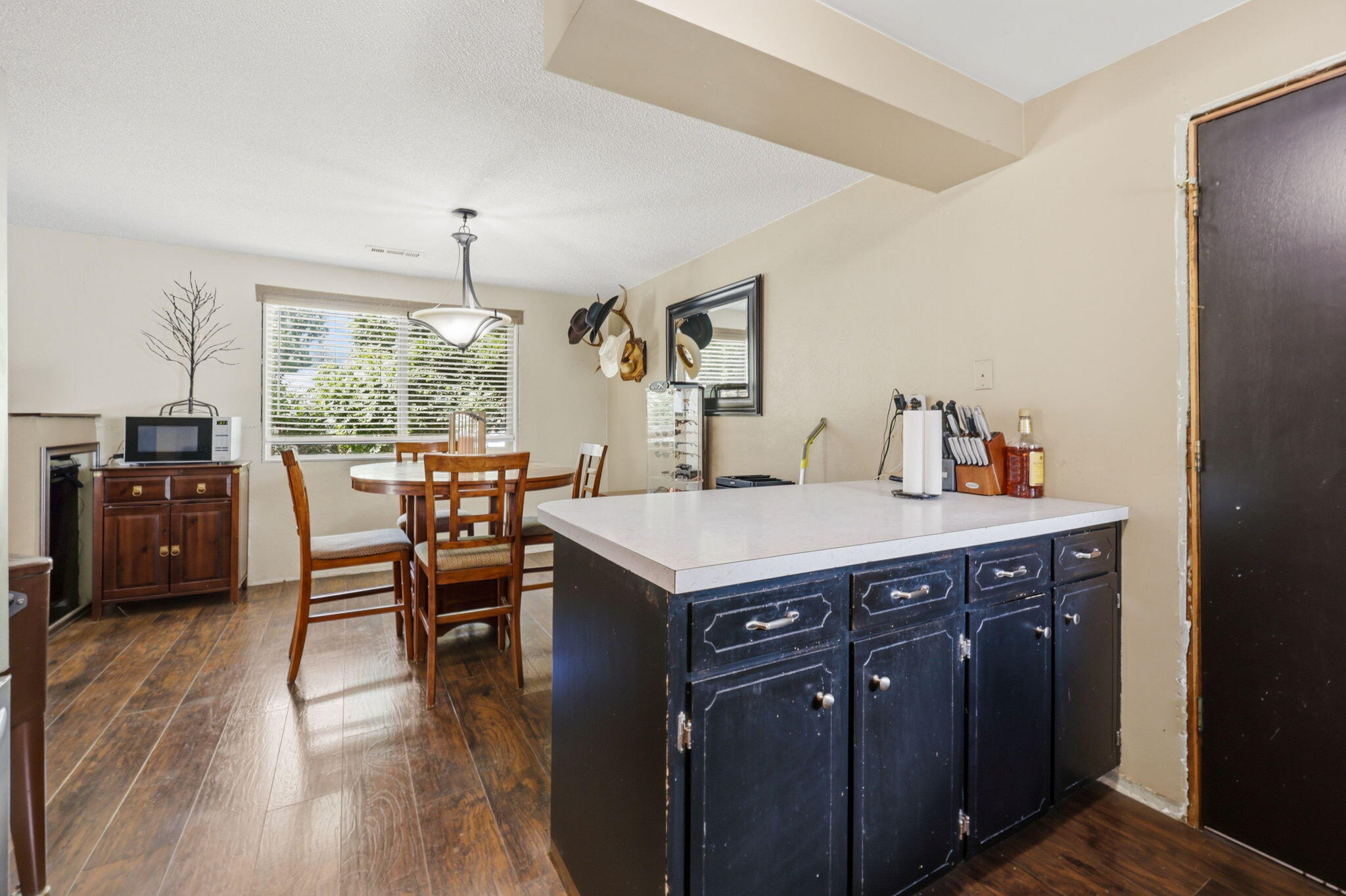 102 Elm Street Phoenix, OR 97535 - Photo 18 of 28 a kitchen with a stove a refrigerator and a dining table