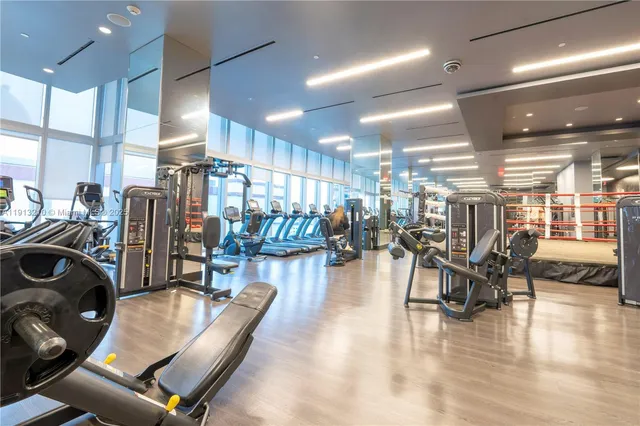 a living room with lots of furniture and wooden floor