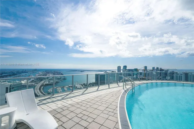 a view of a swimming pool from a balcony
