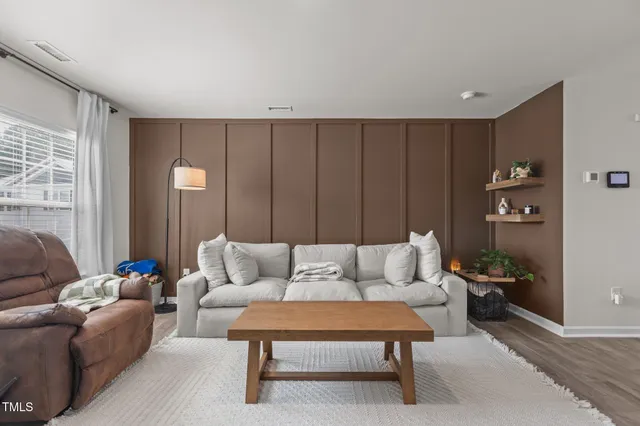 a living room with furniture and a couch