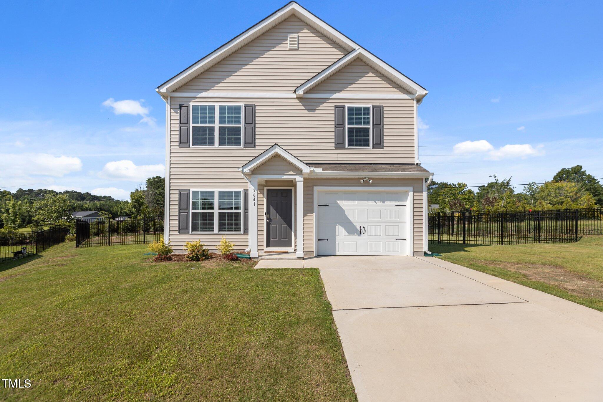 3641 Drafton Drive Raleigh, NC 27610 - Photo 1 of 10 a front view of a house with yard