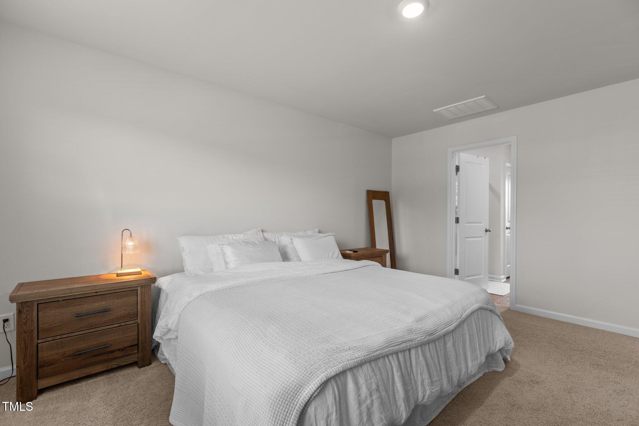 3641 Drafton Drive Raleigh, NC 27610 - Photo 6 of 10 a bedroom with a bed and a closet