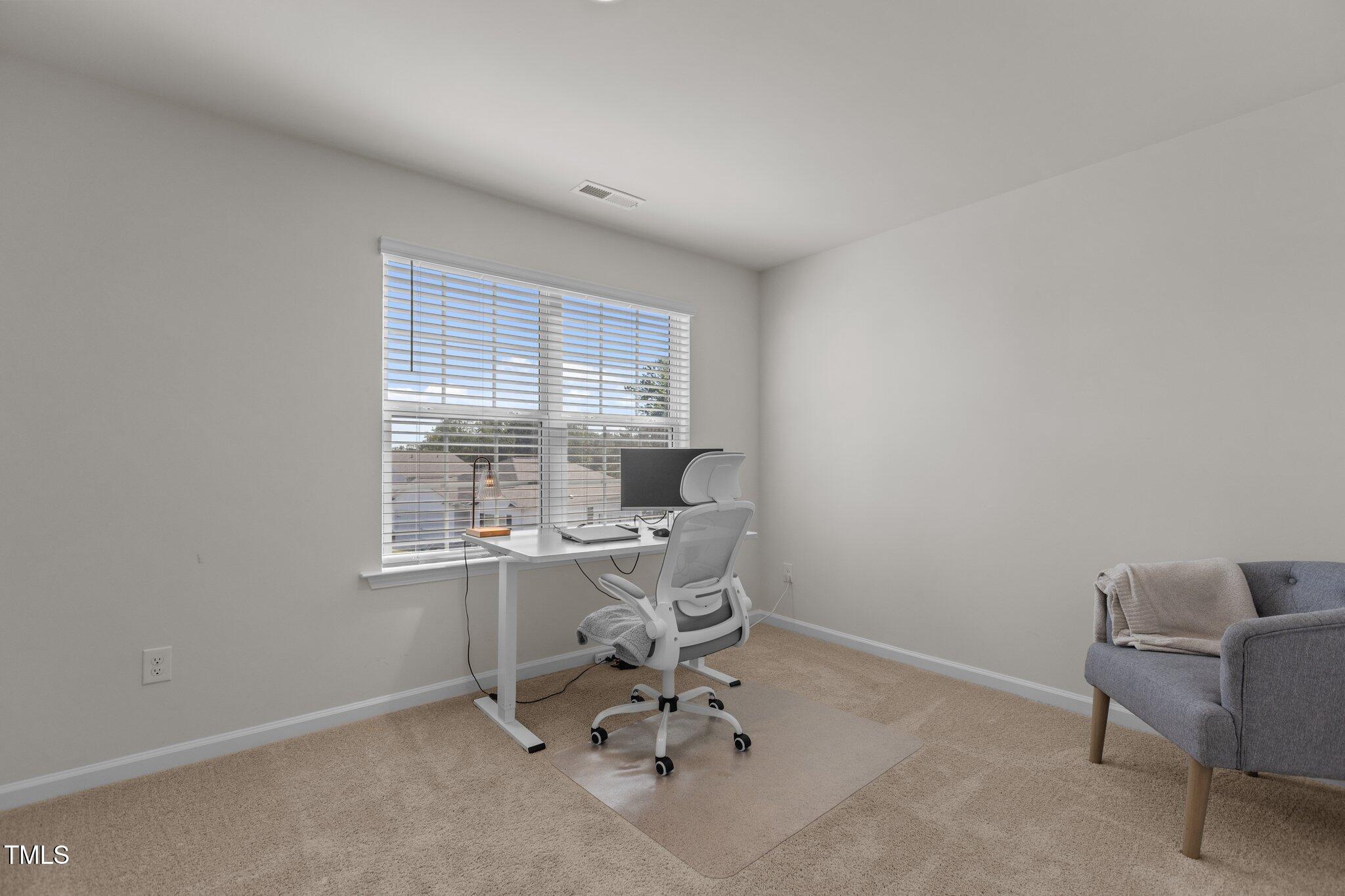 3641 Drafton Drive Raleigh, NC 27610 - Photo 8 of 10 a view of a workspace with a window