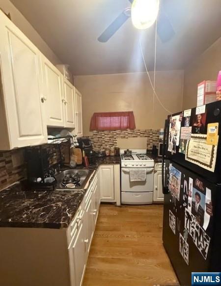 286 North 6th Street Prospect Park, NJ 07508 - Photo 5 of 15 a kitchen with cabinets and appliances