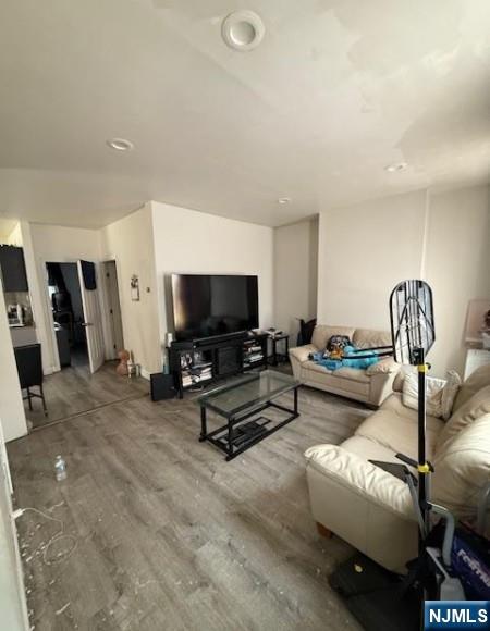286 North 6th Street Prospect Park, NJ 07508 - Photo 7 of 15 a living room with furniture and a flat screen tv