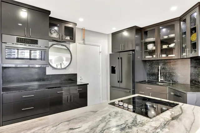 a kitchen with a sink and a refrigerator