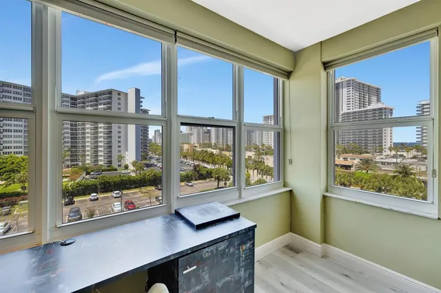 a room with furniture and large window