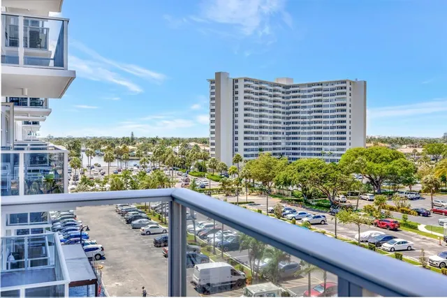 a view of a balcony with an outdoor seating