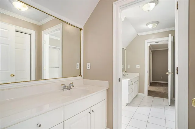 a bathroom with a shower sink and mirror
