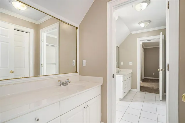 a bathroom with a shower sink and mirror