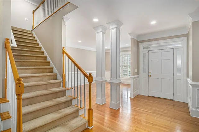 a view of entryway with wooden floor