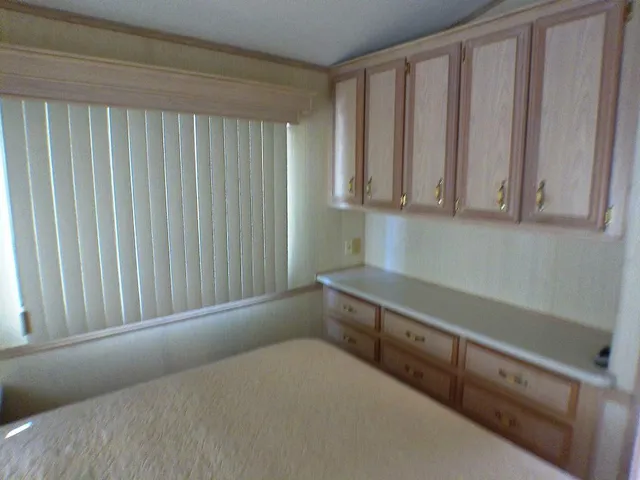 a room with a bed and a window