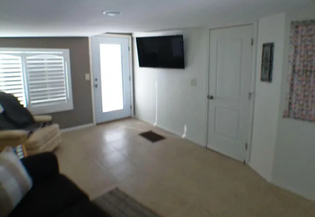 a view of a livingroom with a flat screen tv