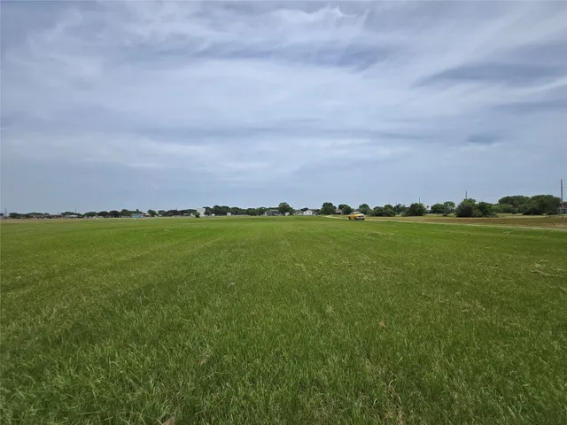 a view of a large building with a yard