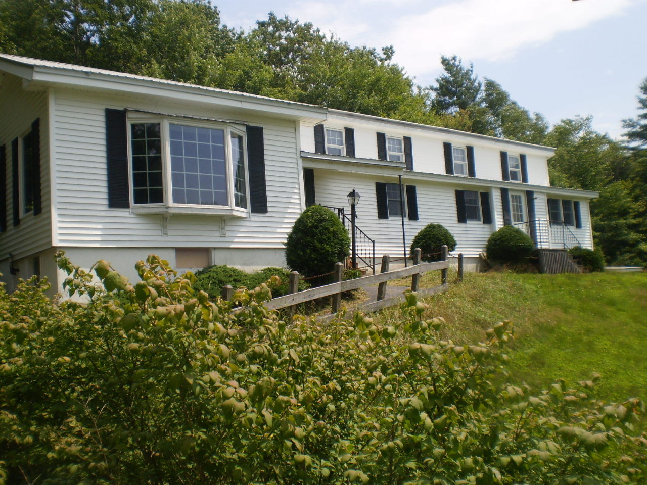 386 Lincoln Road Stamford, VT 05352 - Photo 1 of 1 a house view with a garden space