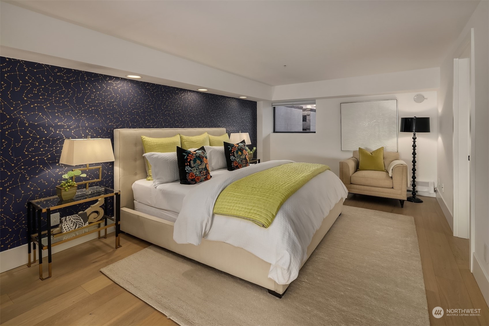 80 Vine Street, Unit 502 Seattle, WA 98121 - Photo 13 of 31 a bedroom with a bed and lamp