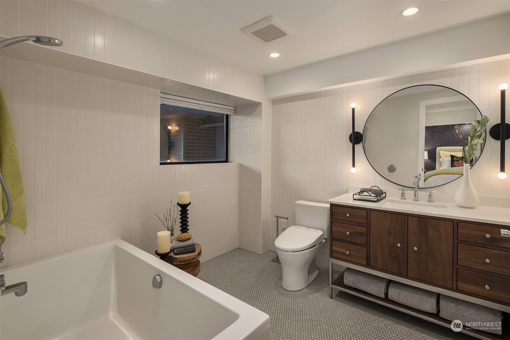 80 Vine Street, Unit 502 Seattle, WA 98121 - Photo 14 of 31 a bathroom with a toilet sink and mirror