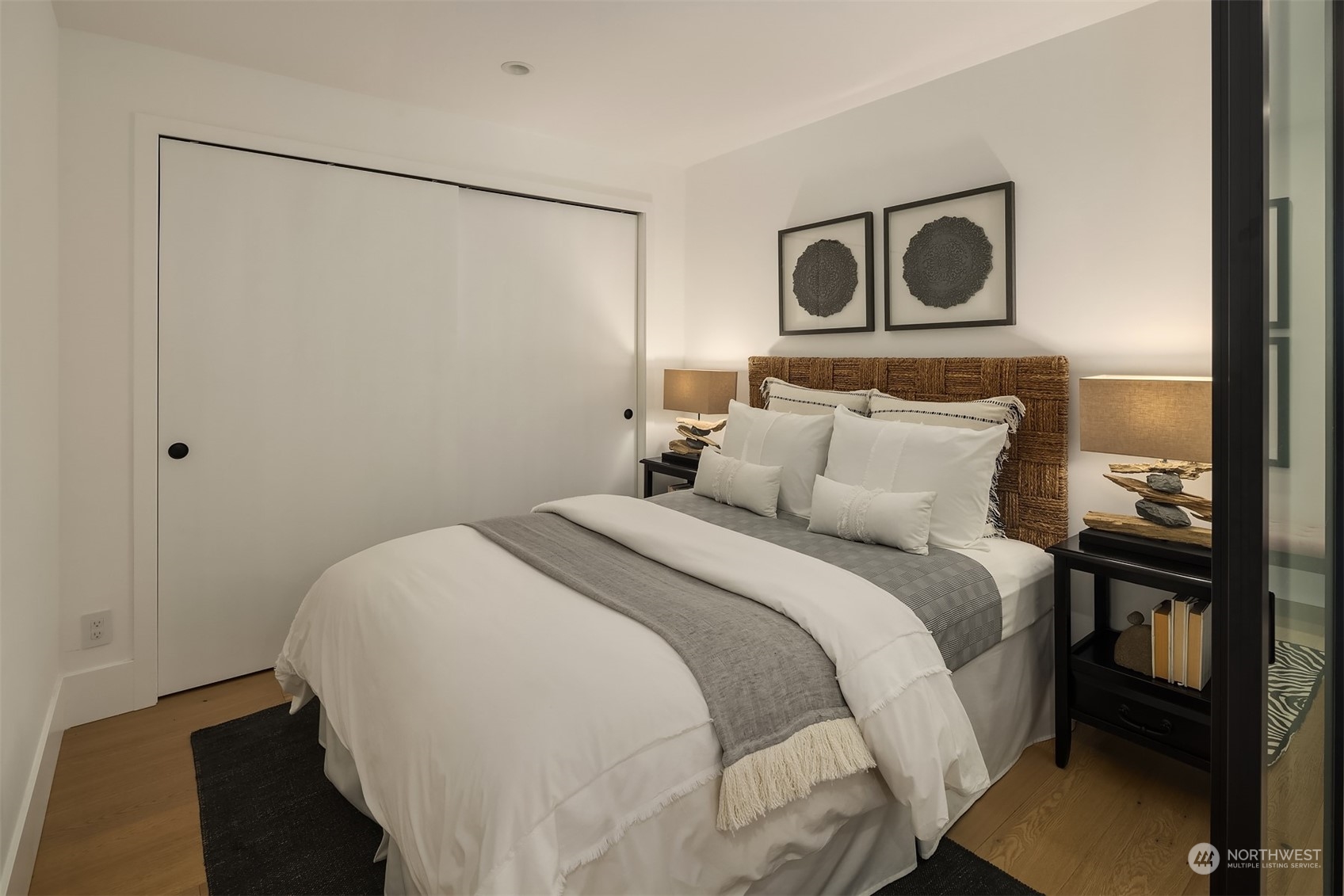 80 Vine Street, Unit 502 Seattle, WA 98121 - Photo 8 of 31 a bedroom with a bed and a painting on the wall