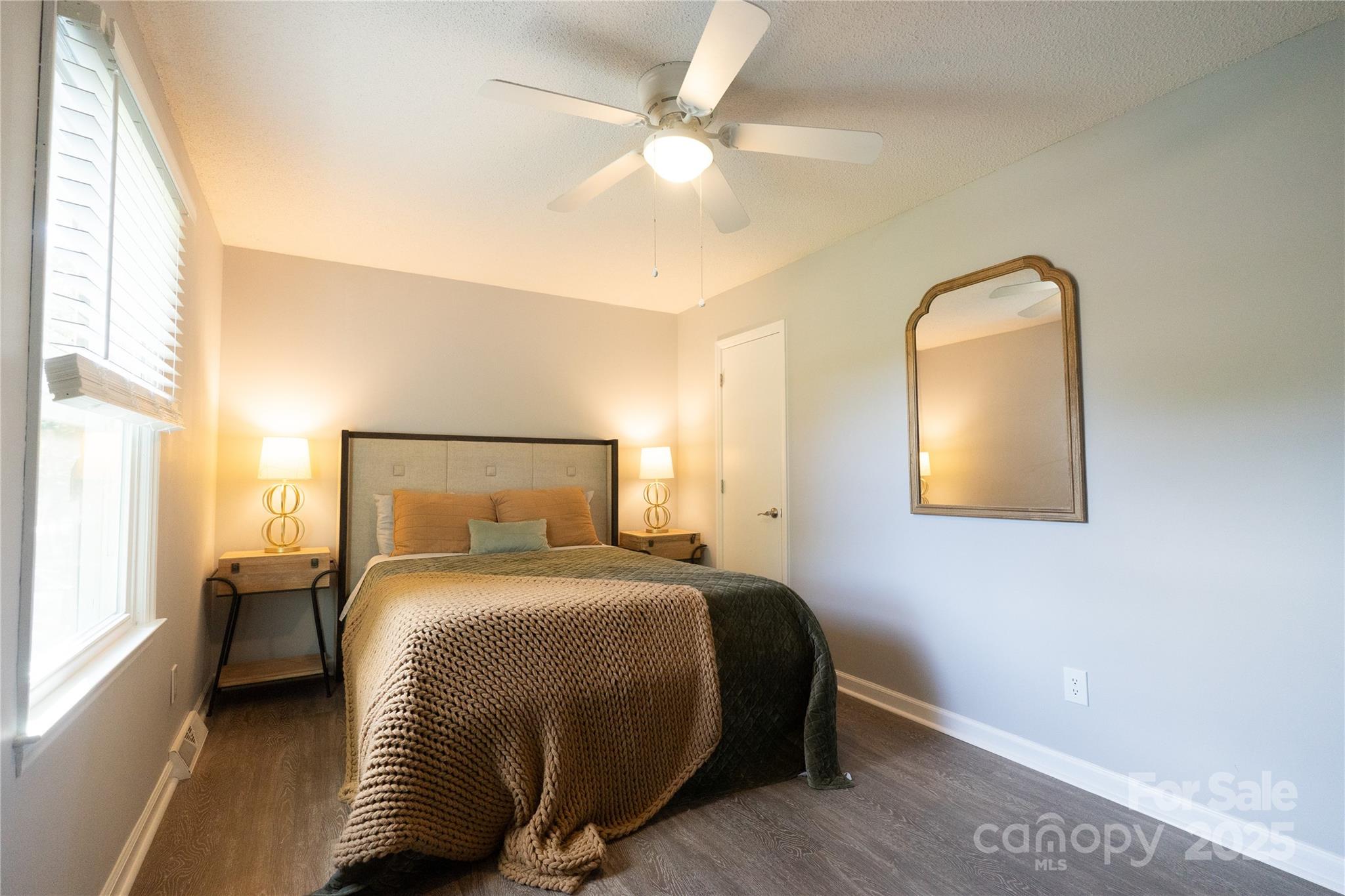 8012 Red Lantern Road Indian Trail, NC 28079 - Photo 11 of 33 a bedroom with a bed and a painting on the wall
