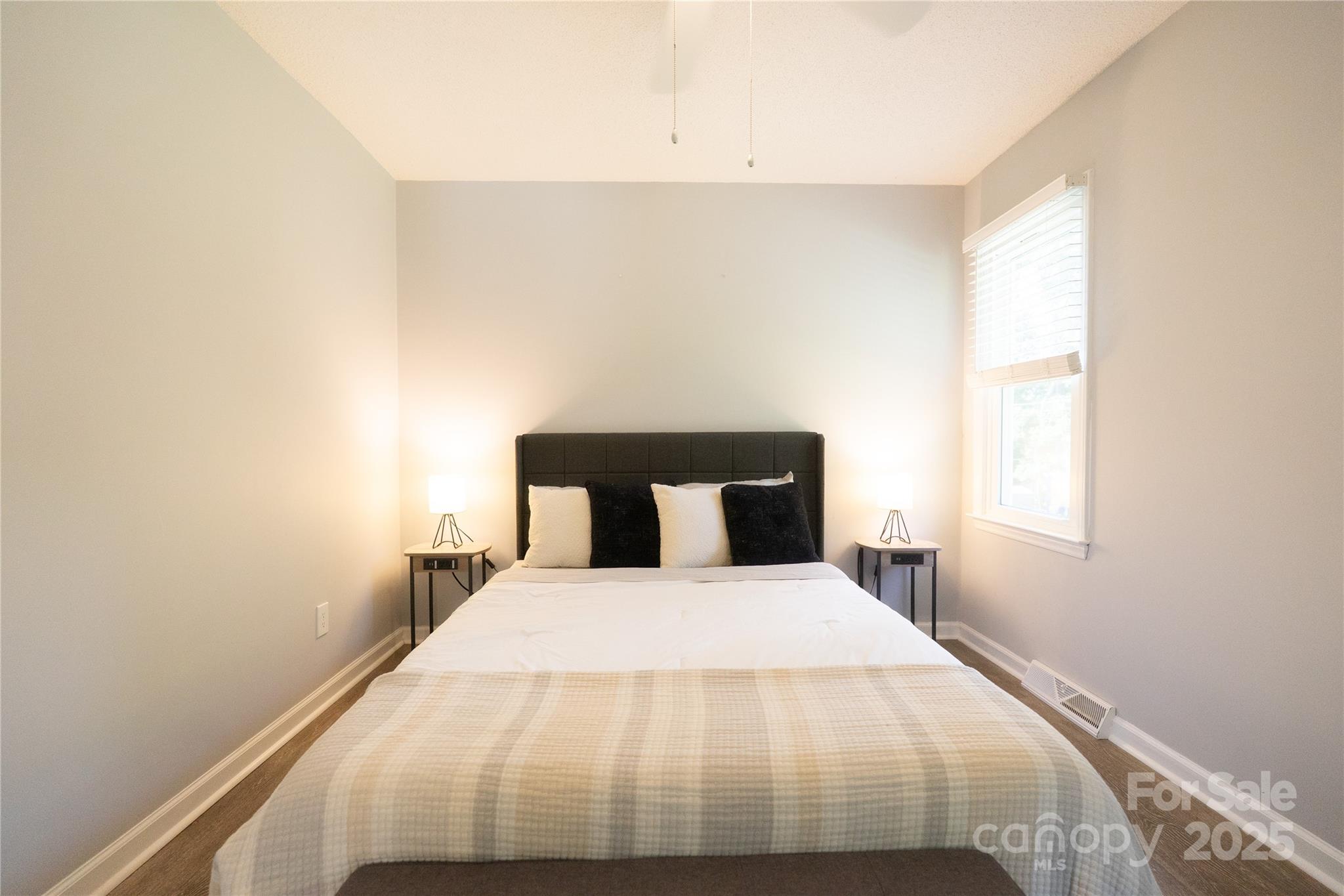 8012 Red Lantern Road Indian Trail, NC 28079 - Photo 15 of 33 a bed sitting in a bedroom next to a window