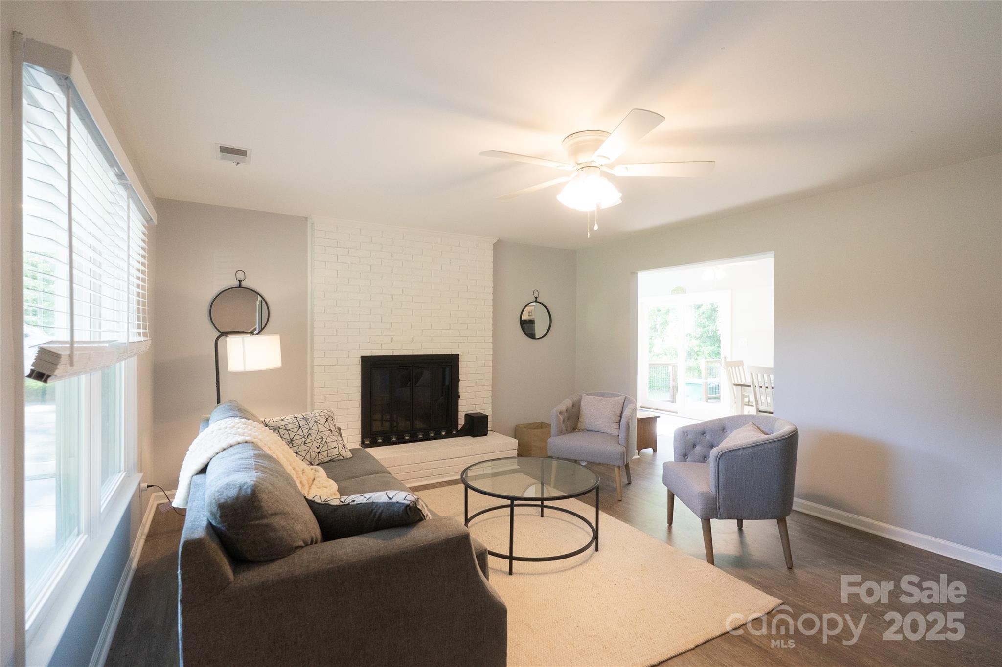 8012 Red Lantern Road Indian Trail, NC 28079 - Photo 20 of 33 a living room with furniture a chandelier and a window