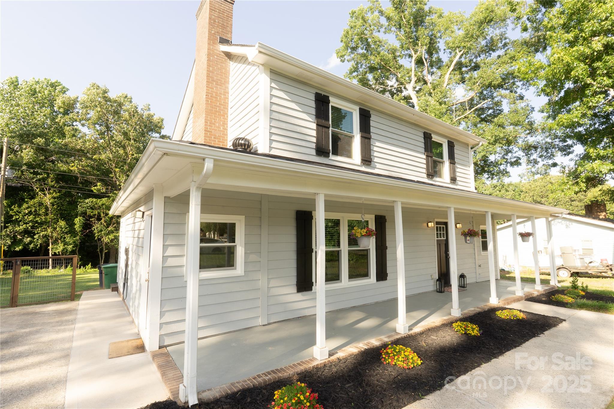 8012 Red Lantern Road Indian Trail, NC 28079 - Photo 2 of 33 a front view of a house with a patio