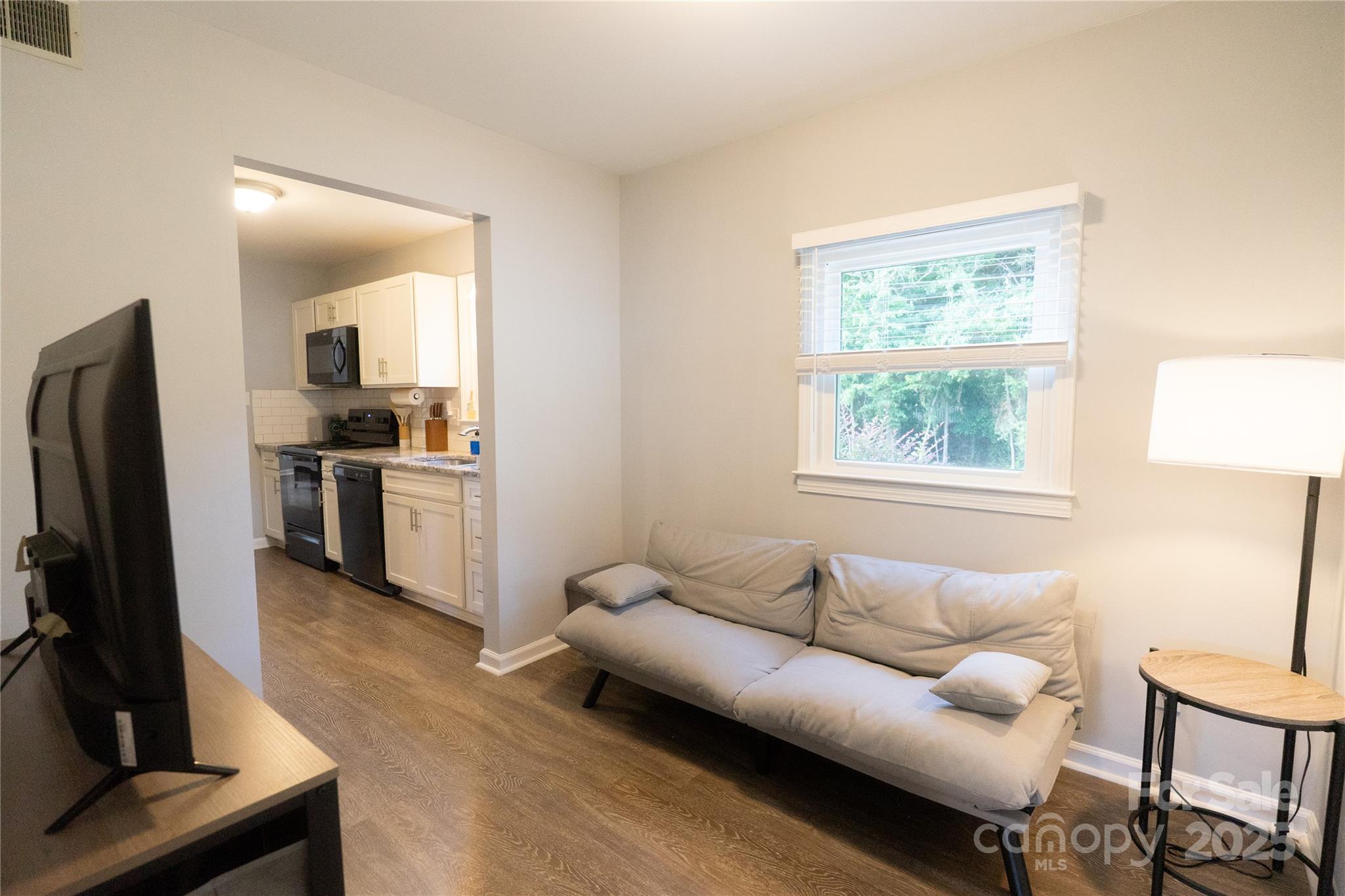 8012 Red Lantern Road Indian Trail, NC 28079 - Photo 24 of 33 a living room with furniture and a flat screen tv