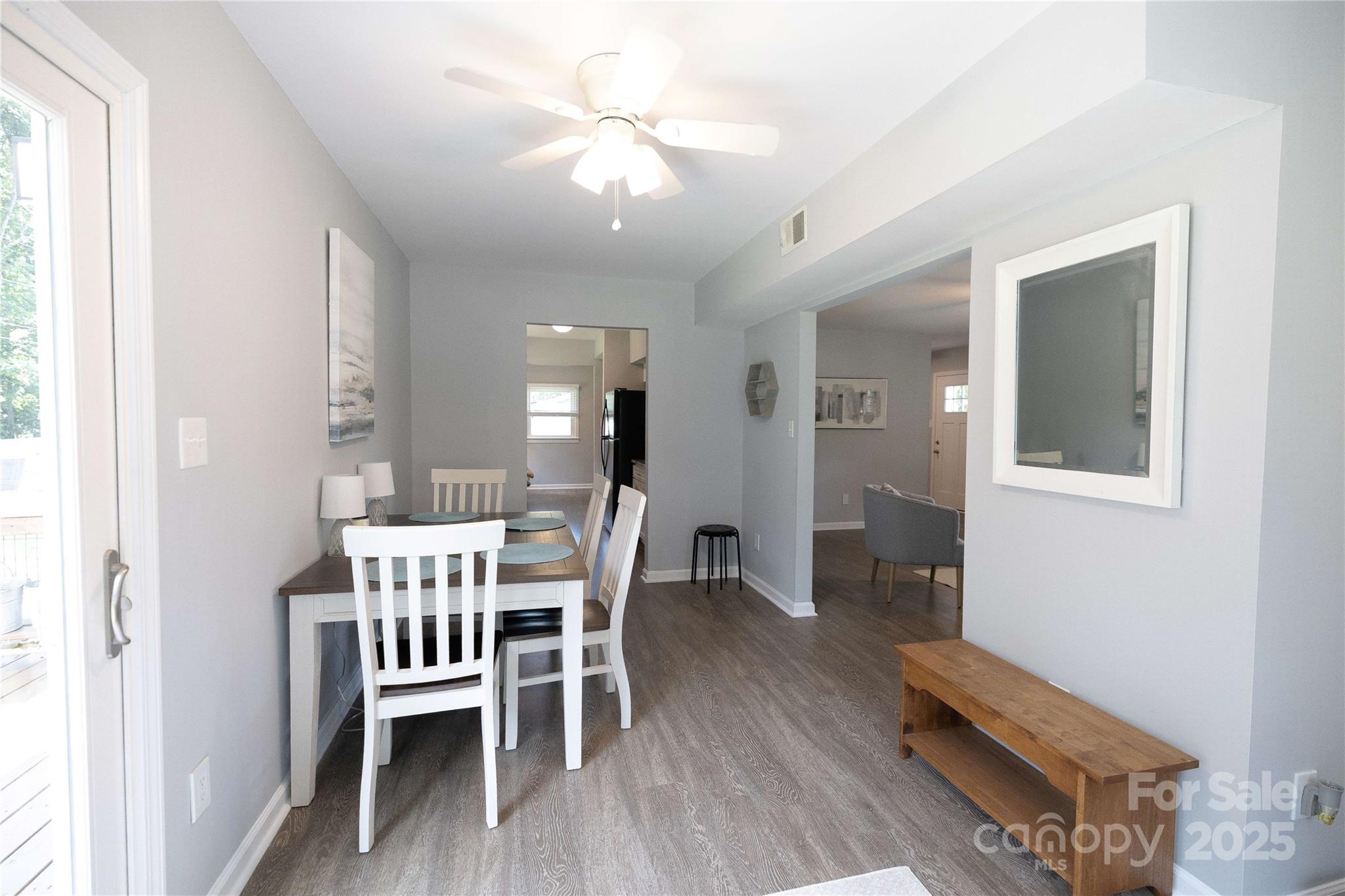 8012 Red Lantern Road Indian Trail, NC 28079 - Photo 6 of 33 a view of a dining room with furniture and wooden floor