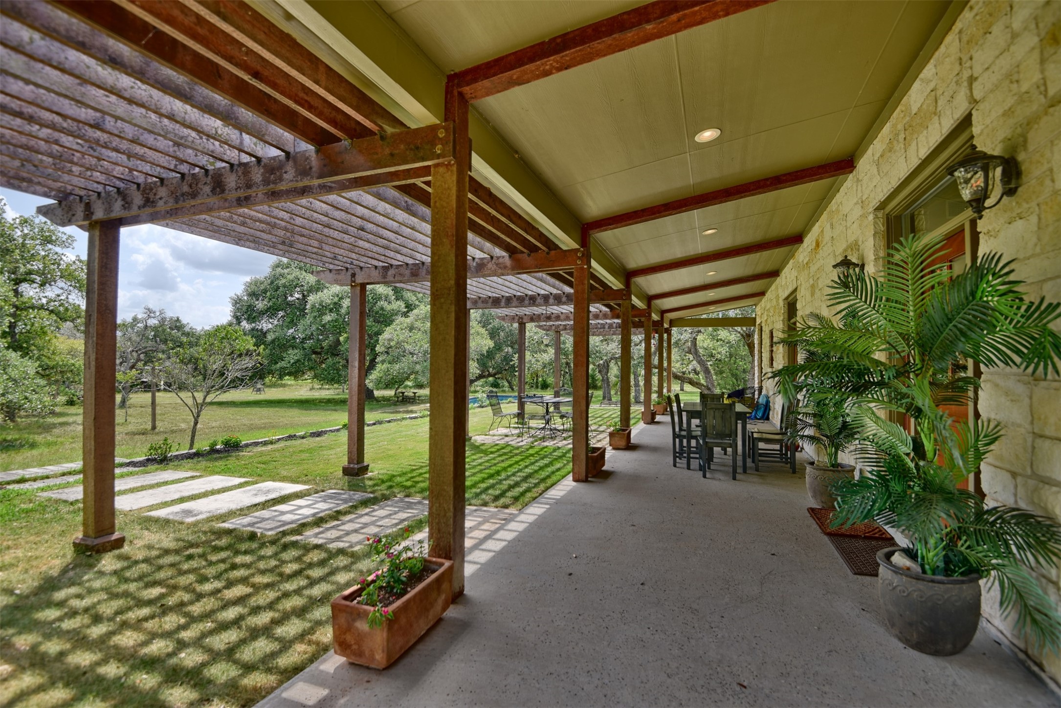 2003 Oak Ridge Road Weimar, TX 78962 - Photo 3 of 35 a view of a porch with furniture and garden