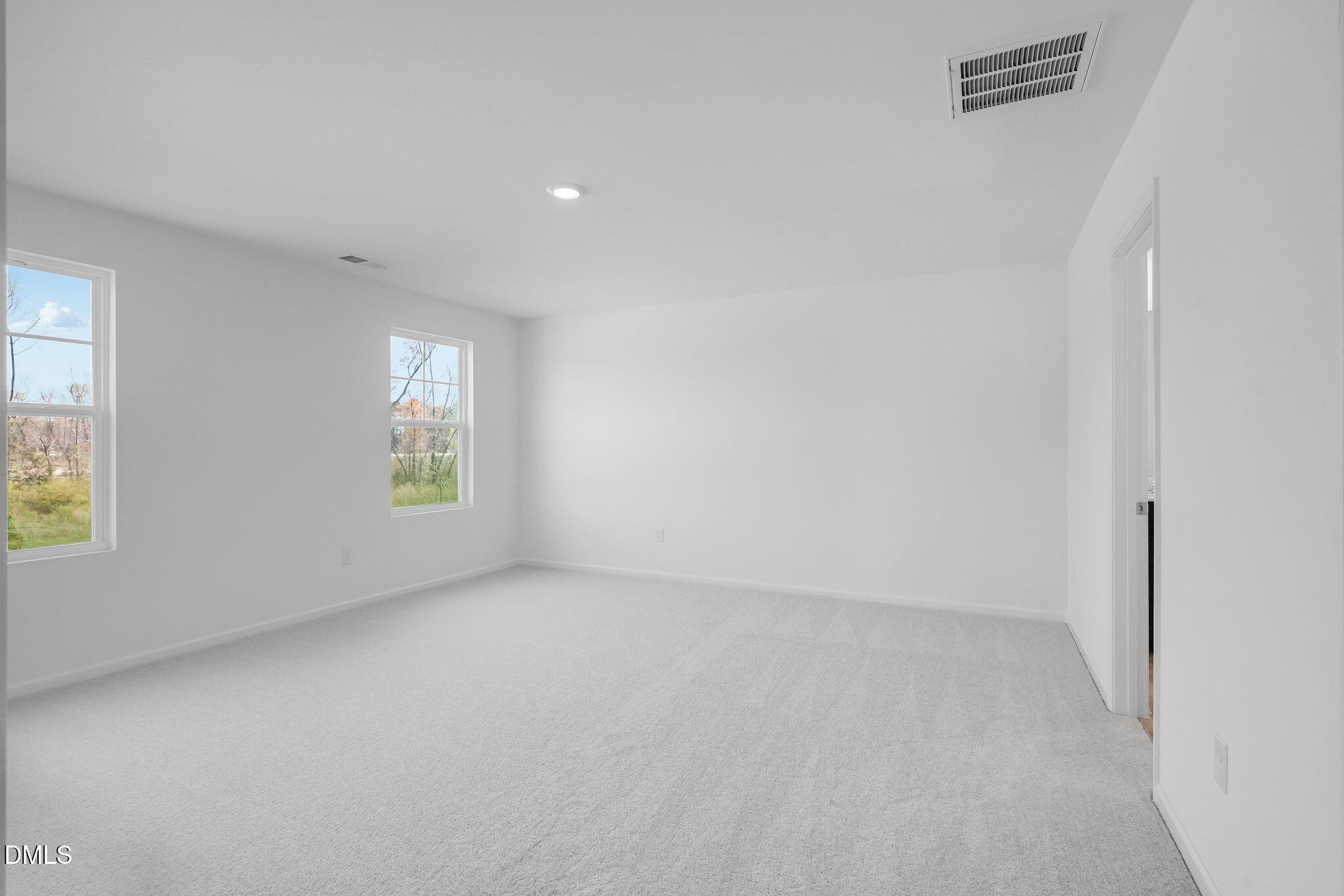 5818 Millstone Way Sims, NC 27880 - Photo 18 of 24 an empty room with windows