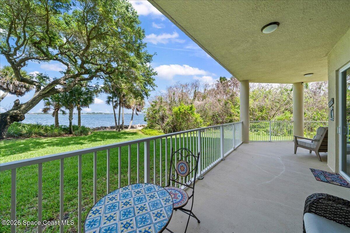 6005 Highway 1, Unit 101 Rockledge, FL 32955 - Photo 32 of 57 a view of a chair and tables in the balcony