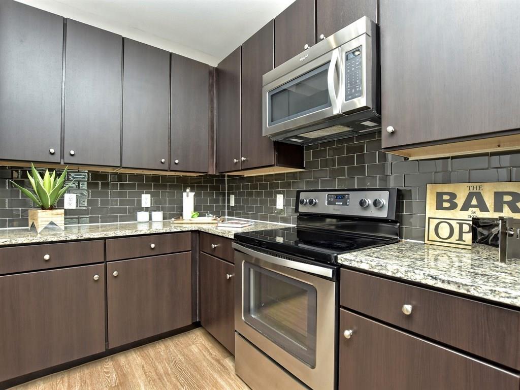 1900 Barton Springs Road, Unit 4017 Austin, TX 78704 - Photo 4 of 34 This image of the interior is representative and not of actual unit. Finishes including cabinetry, countertops, backsplash and flooring are the same. Unit 4017 is mirrored of this representative unit.
