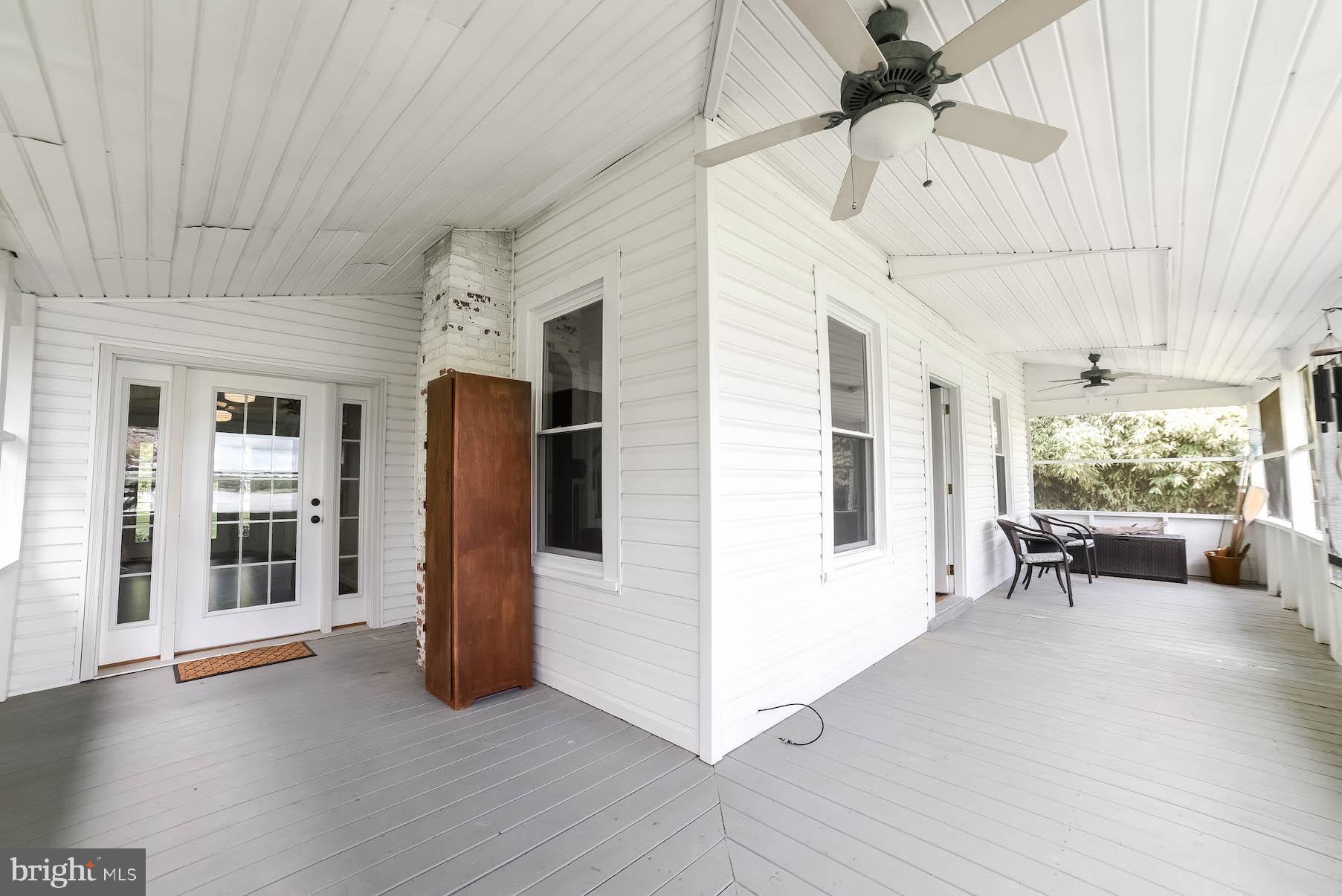 45054 Trooper's Road Tall Timbers, MD 20690 - Photo 45 of 73 Porch wraps around in an "L" to join the sunroom