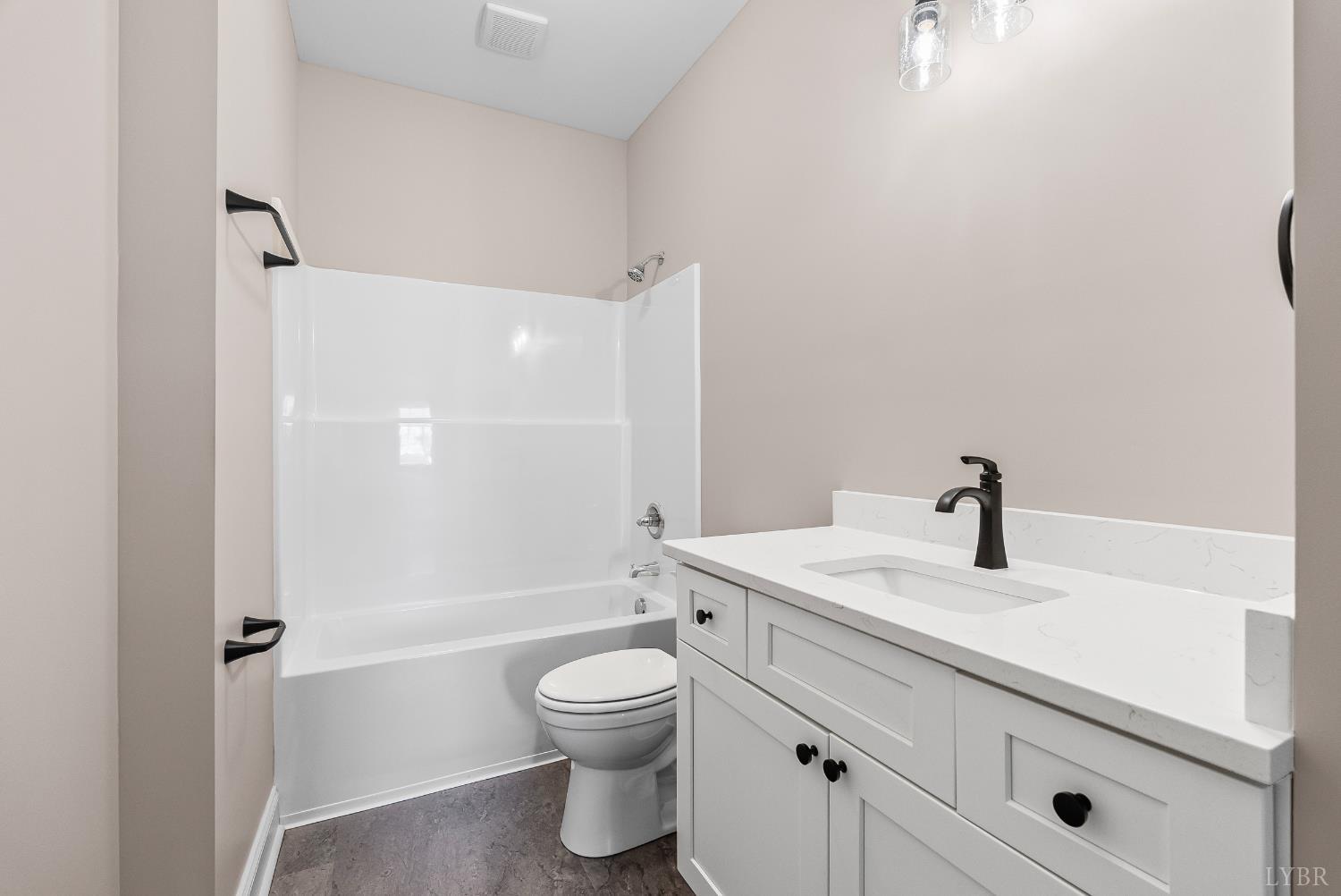 1303 4th Street Altavista, VA 24517 - Photo 13 of 36 a bathroom with a sink a toilet and shower