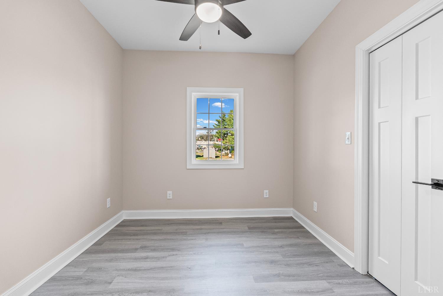 1303 4th Street Altavista, VA 24517 - Photo 14 of 36 an empty room with a window and a ceiling fan