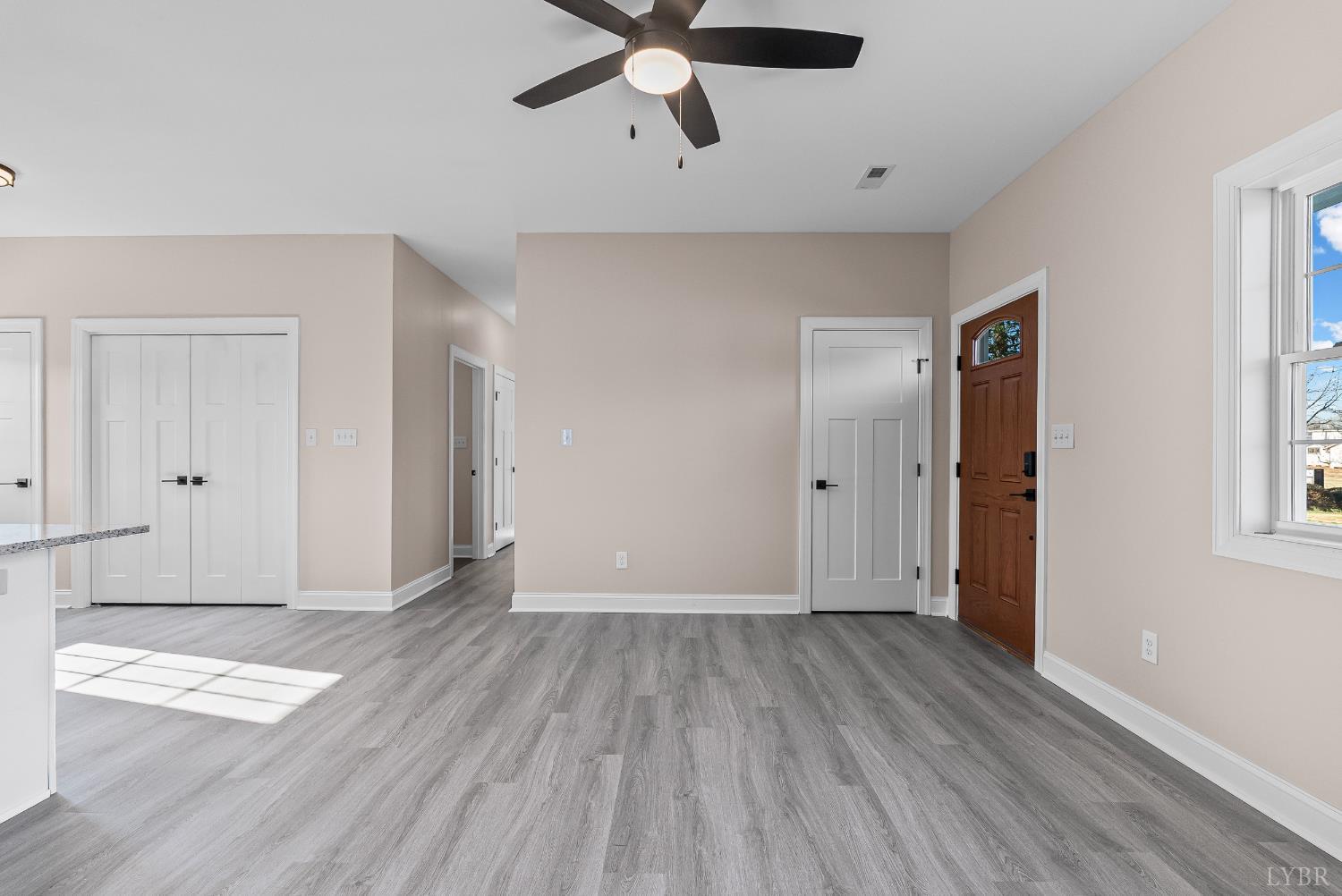 1303 4th Street Altavista, VA 24517 - Photo 5 of 36 wooden floor in an empty room with a window