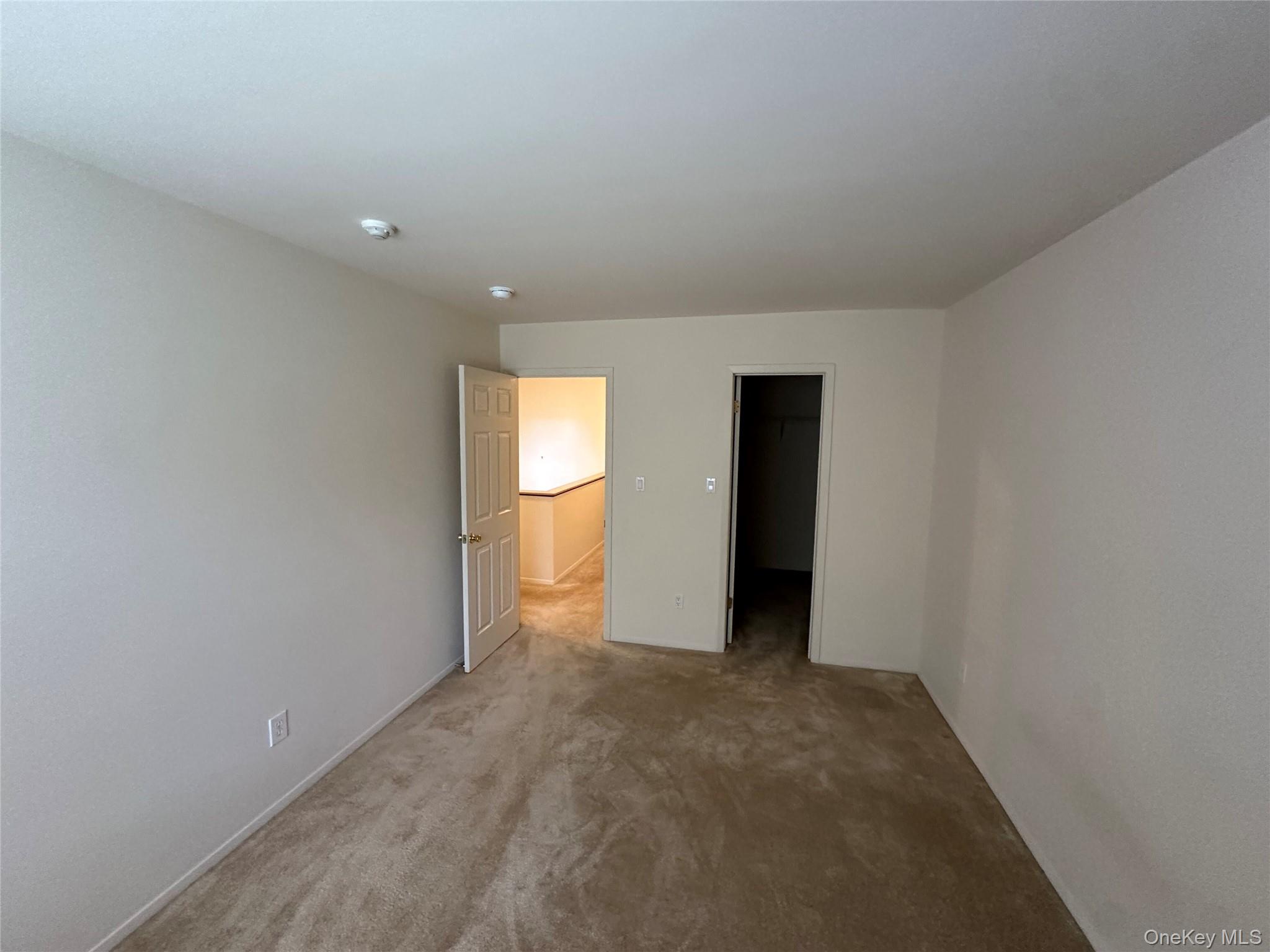 328 Prairie Court Manorville, NY 11949 - Photo 12 of 19 a view of an empty room with a window