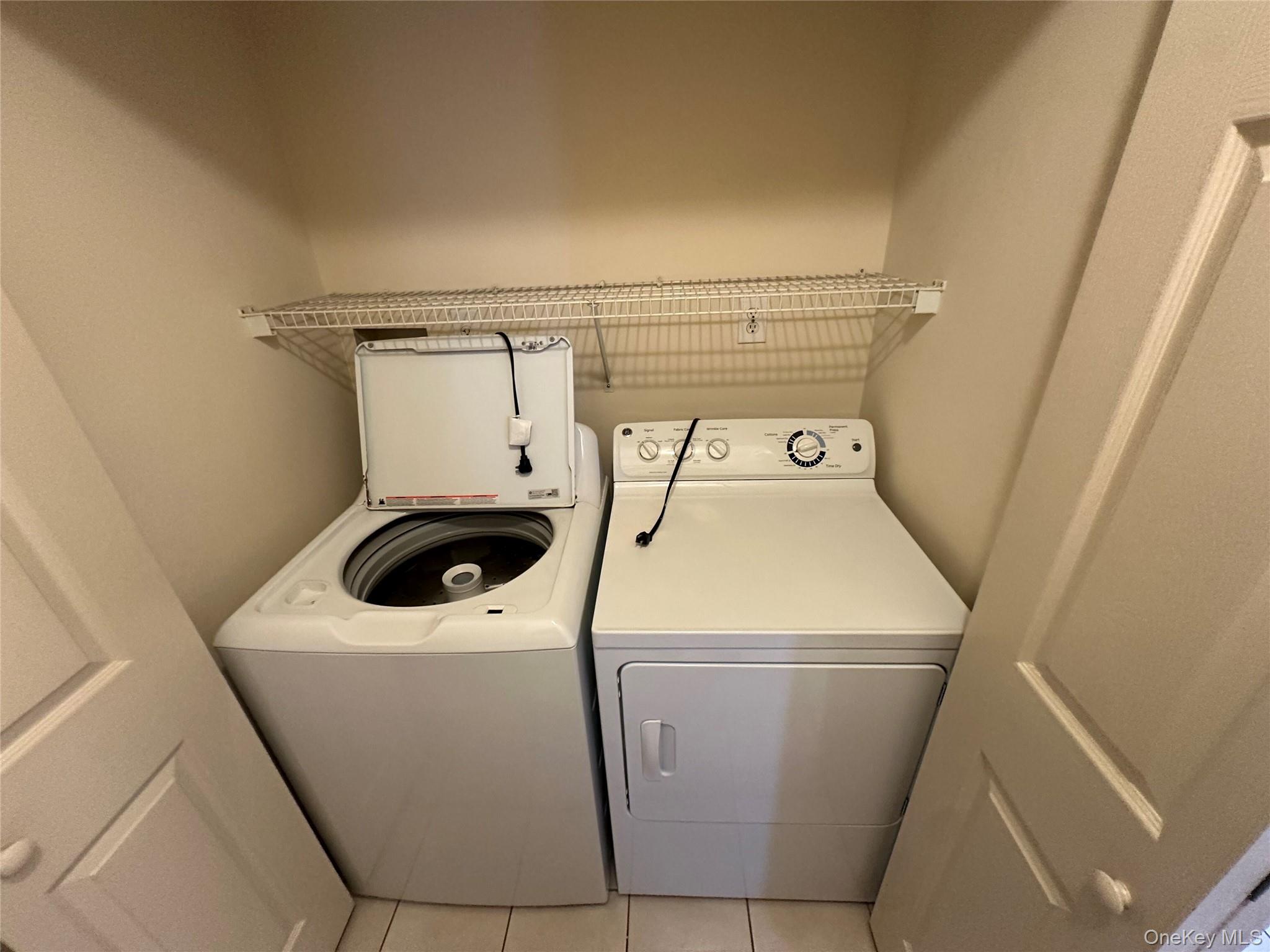 328 Prairie Court Manorville, NY 11949 - Photo 16 of 19 a utility room with dryer and washer