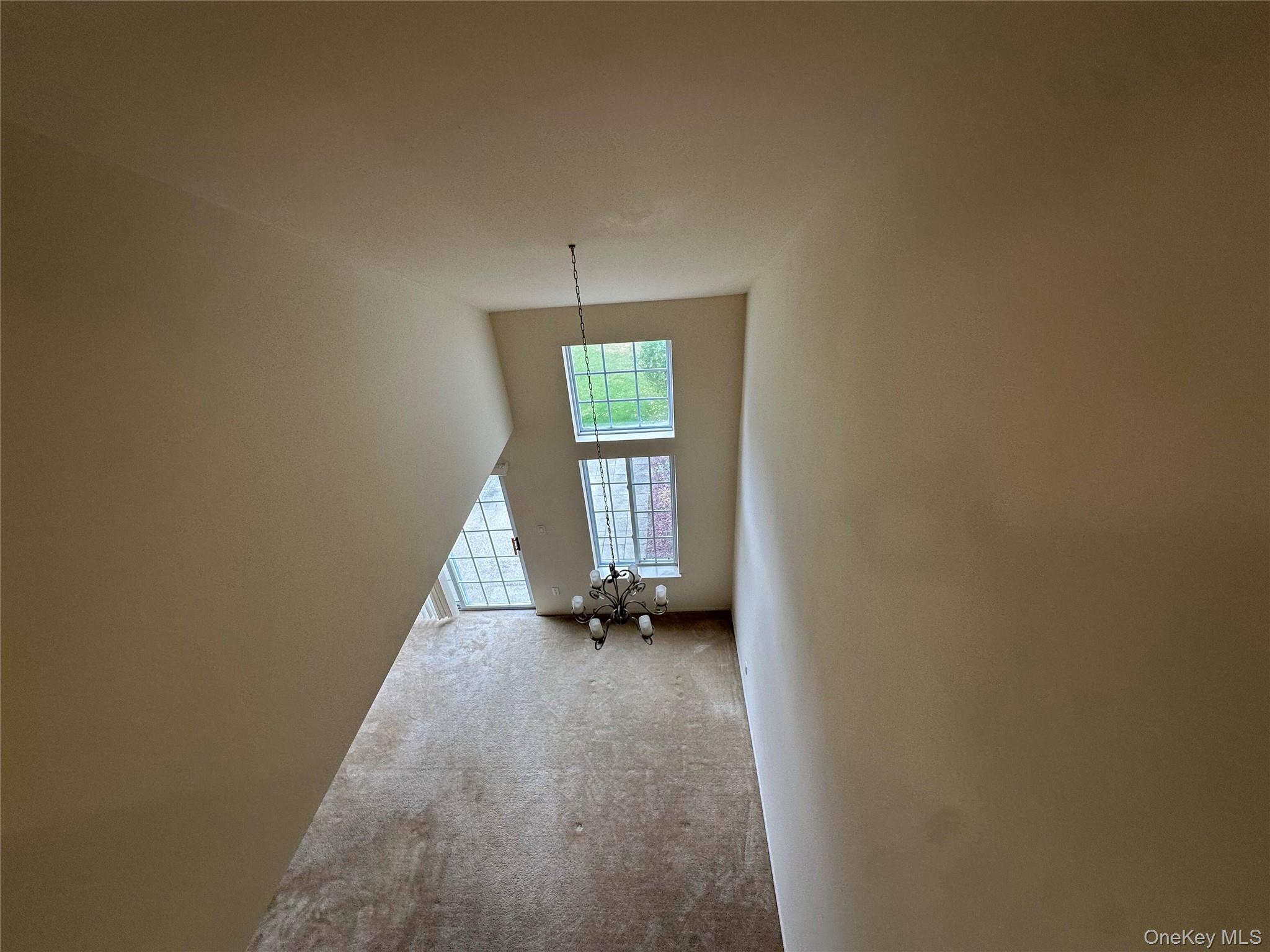 328 Prairie Court Manorville, NY 11949 - Photo 5 of 19 a view of an empty room and window