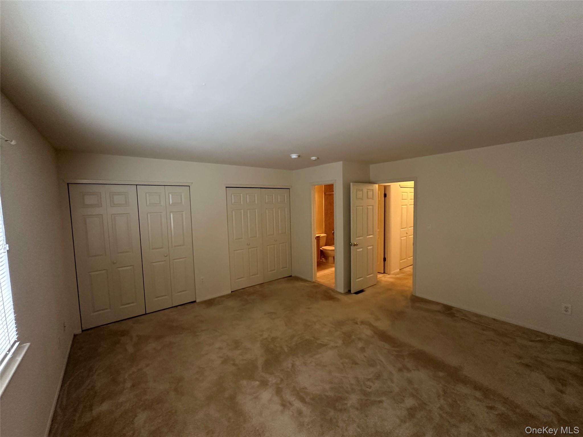 328 Prairie Court Manorville, NY 11949 - Photo 9 of 19 an empty room with windows