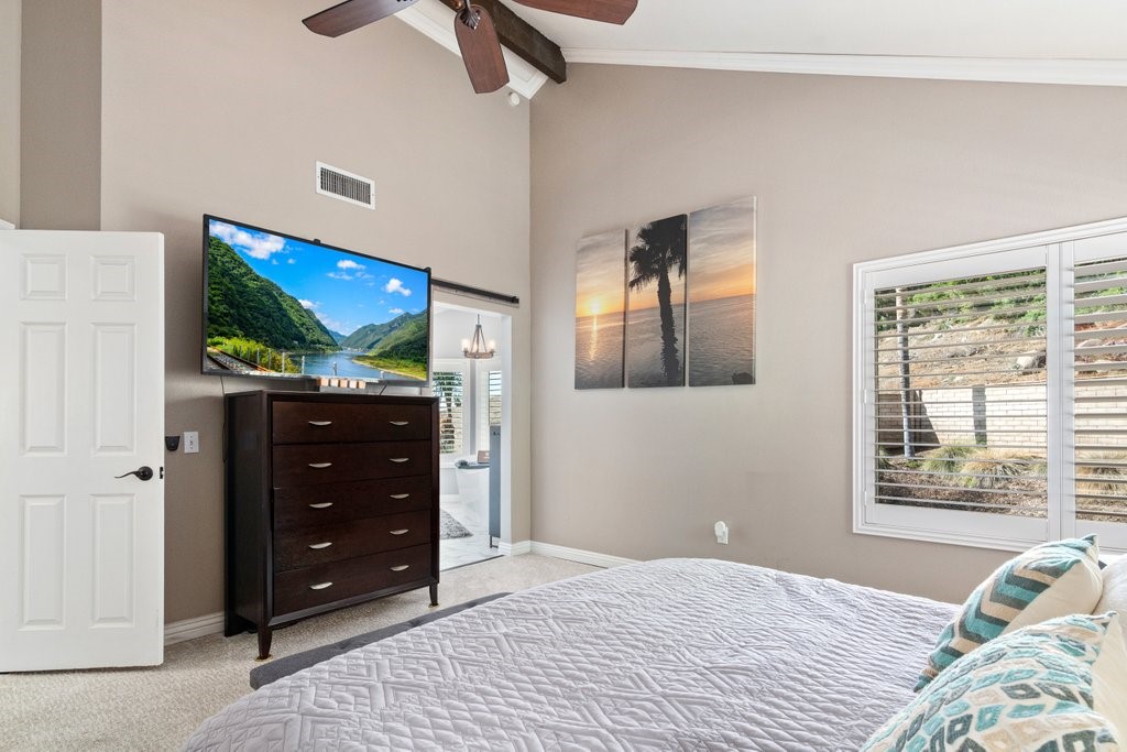 8251 Bent Tree Lane Riverside, CA 92509 - Photo 26 of 57 Primary bedroom with barn door leading to the bathroom