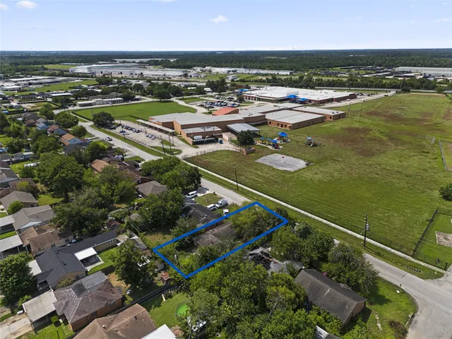 an aerial view of a city with lawn chairs