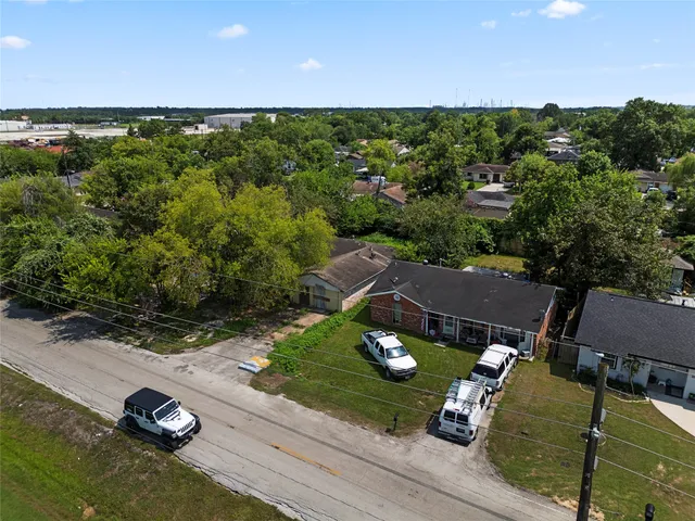 an aerial view of a house with outdoor space