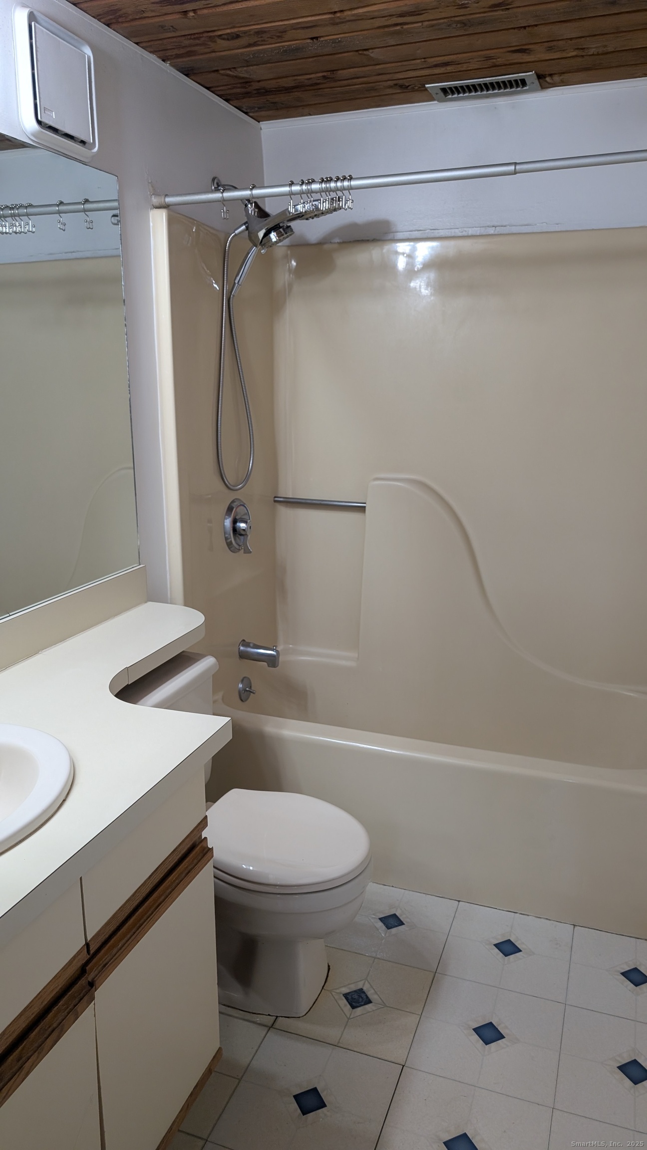 839 Main Street, Unit 61 Torrington, CT 06790 - Photo 12 of 18 a bathroom with a sink a toilet and shower